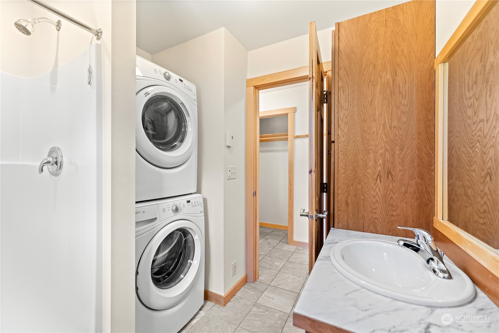 81 Homestead Road Winthrop, WA 98862 - Photo 16 of 39 a bathroom with a sink a washer and dryer