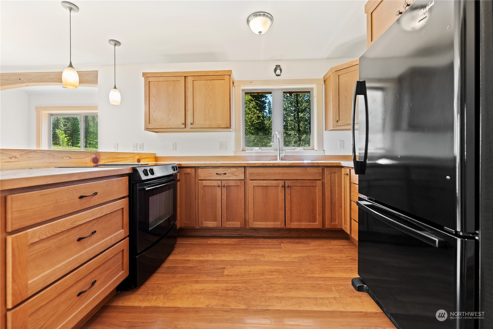 81 Homestead Road Winthrop, WA 98862 - Photo 28 of 39 a kitchen with a stove sink and refrigerator
