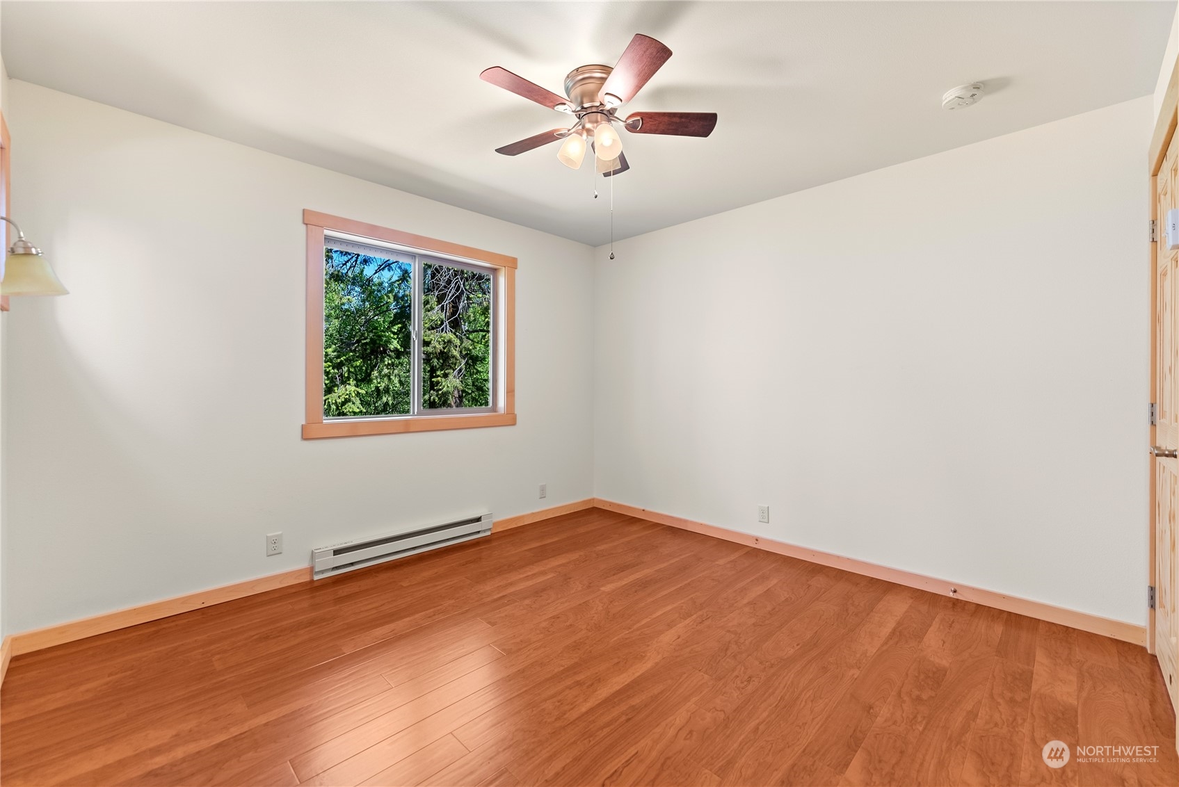 81 Homestead Road Winthrop, WA 98862 - Photo 32 of 39 an empty room with a window and a ceiling fan