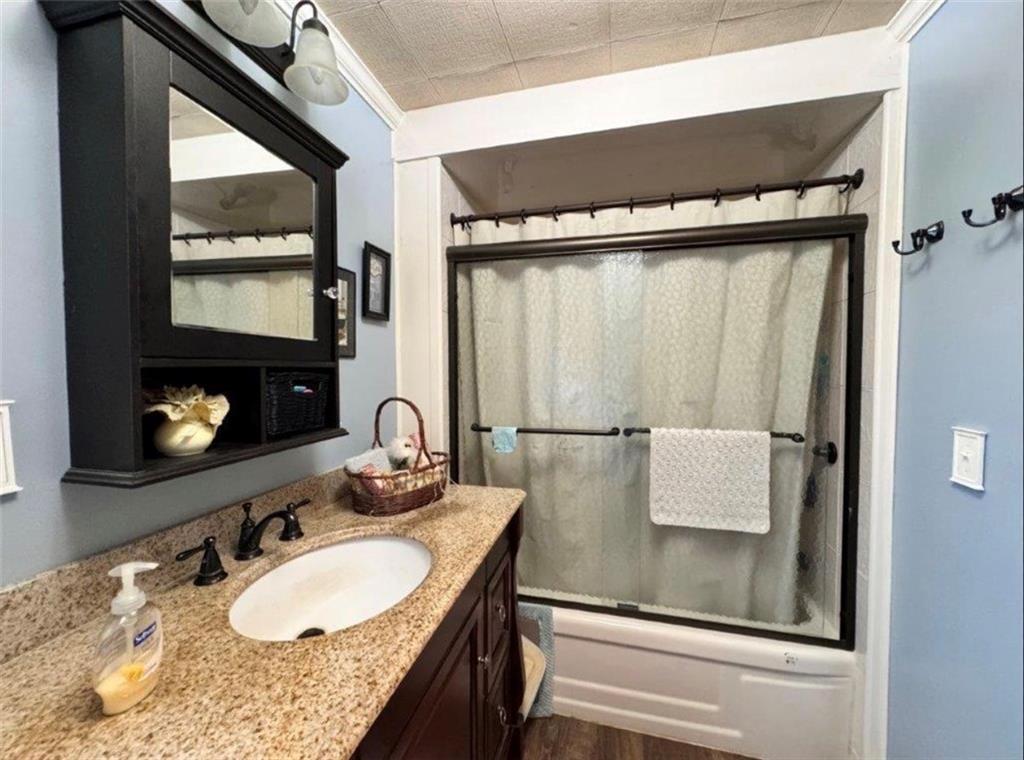 668 Highway 536 Mayport, PA 16240 - Photo 13 of 26 a bathroom with a granite countertop sink a mirror and vanity