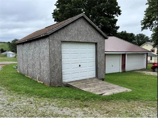 a view of a tiny house with a yard