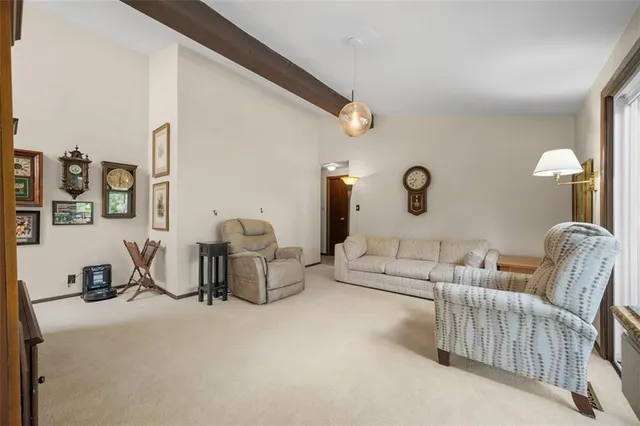 a living room with furniture and a lamp