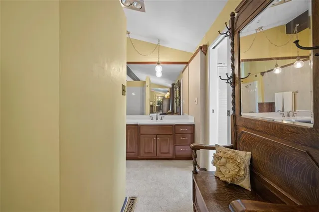 a bathroom with a sink a mirror and a bathtub