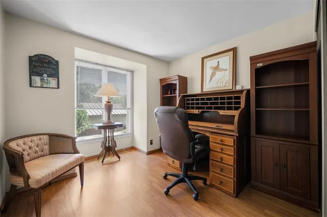 a view of a livingroom with workspace and a couch