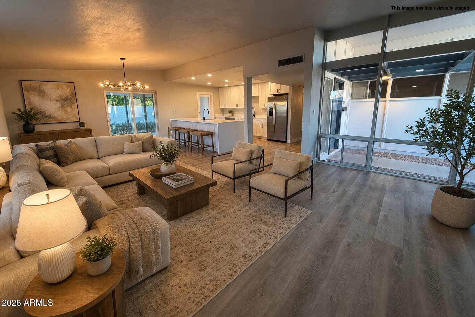 5420 North Granite Reef Road Scottsdale, AZ 85250 - Photo 10 of 30 a living room with furniture and a potted plant