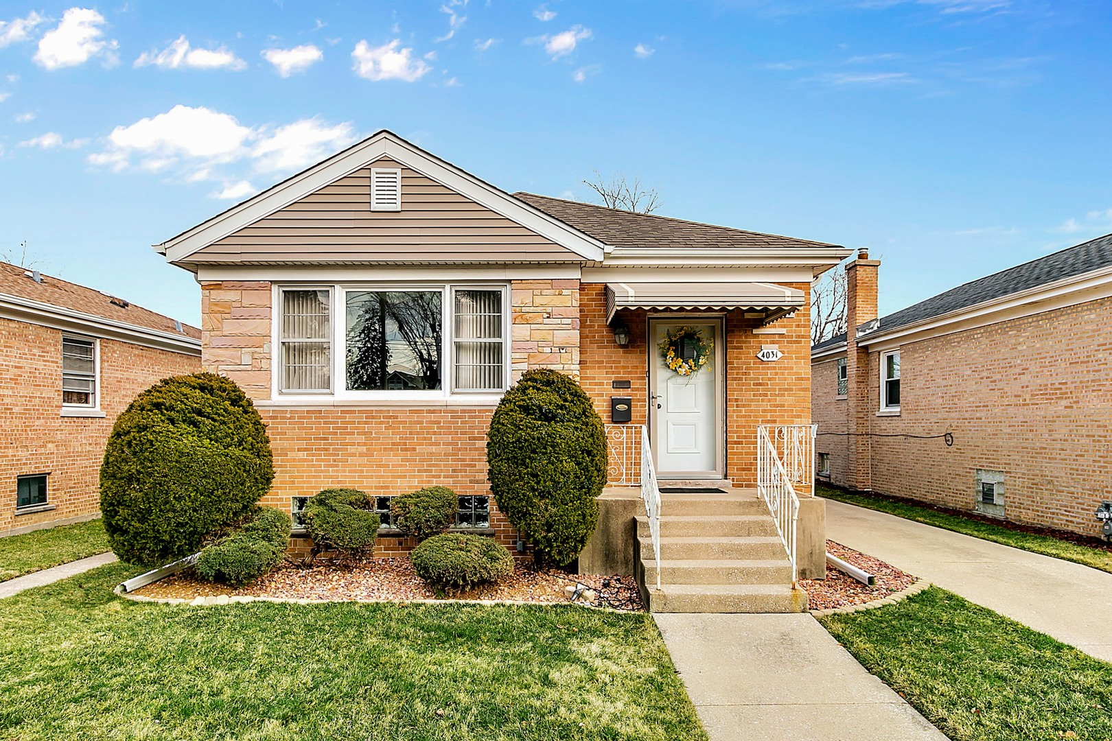 a front view of a house with garden
