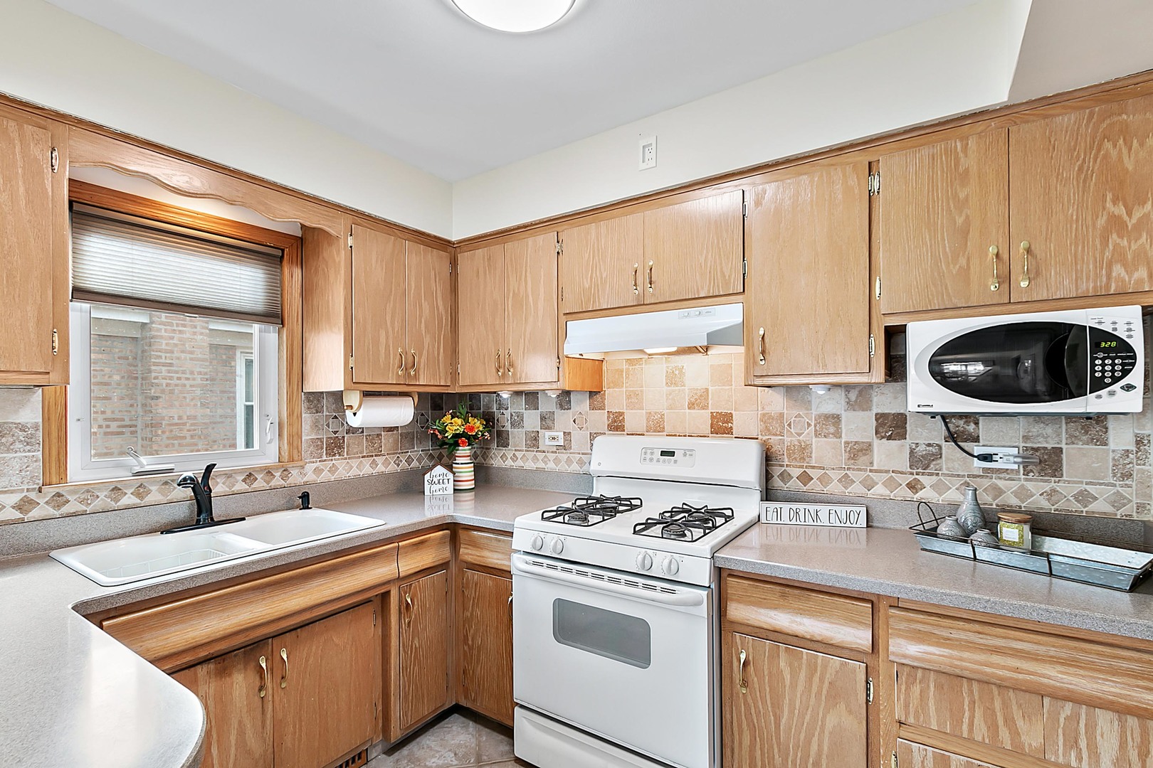 4031 Custer Avenue Lyons, IL 60534 - Photo 11 of 19 a kitchen with a stove and a sink