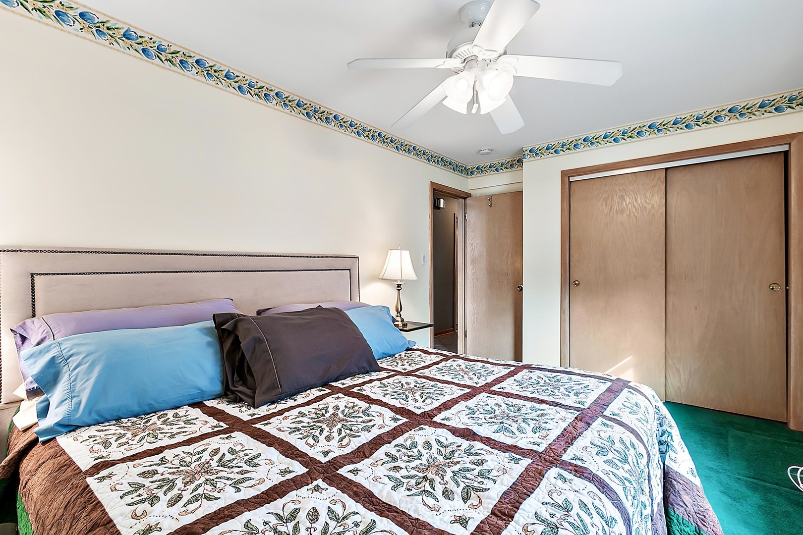 4031 Custer Avenue Lyons, IL 60534 - Photo 13 of 19 a bedroom with a bed and a chandelier