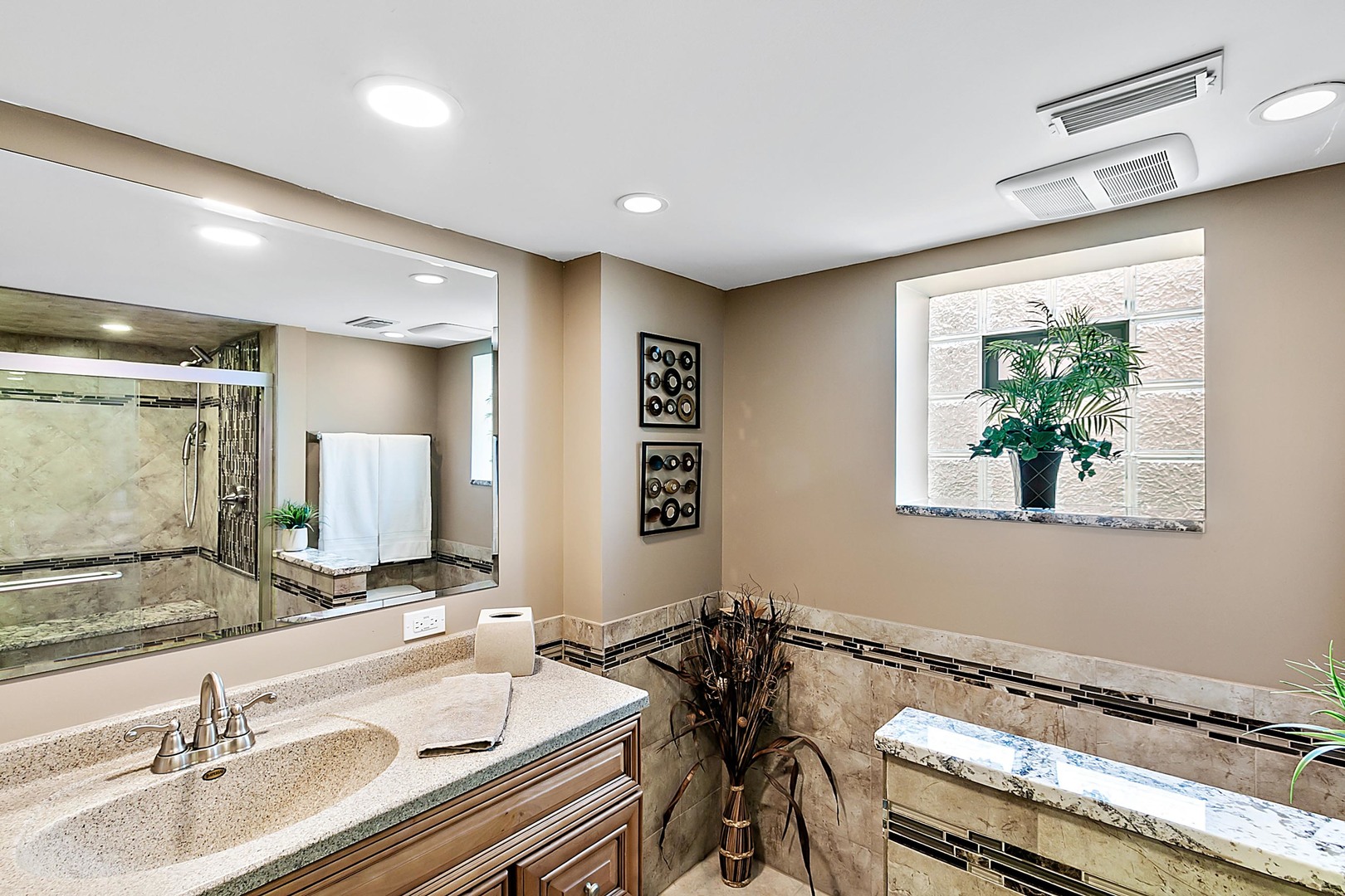 4031 Custer Avenue Lyons, IL 60534 - Photo 15 of 19 a bathroom with a granite countertop sink and a mirror