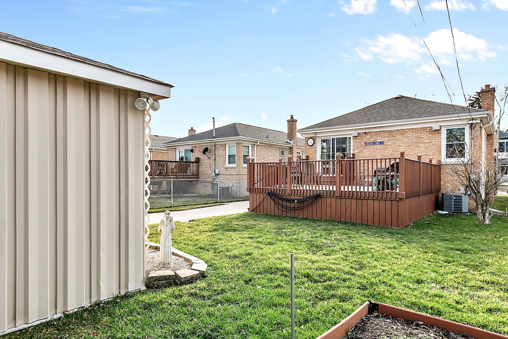 4031 Custer Avenue Lyons, IL 60534 - Photo 19 of 19 a view of a house with a big yard and large trees