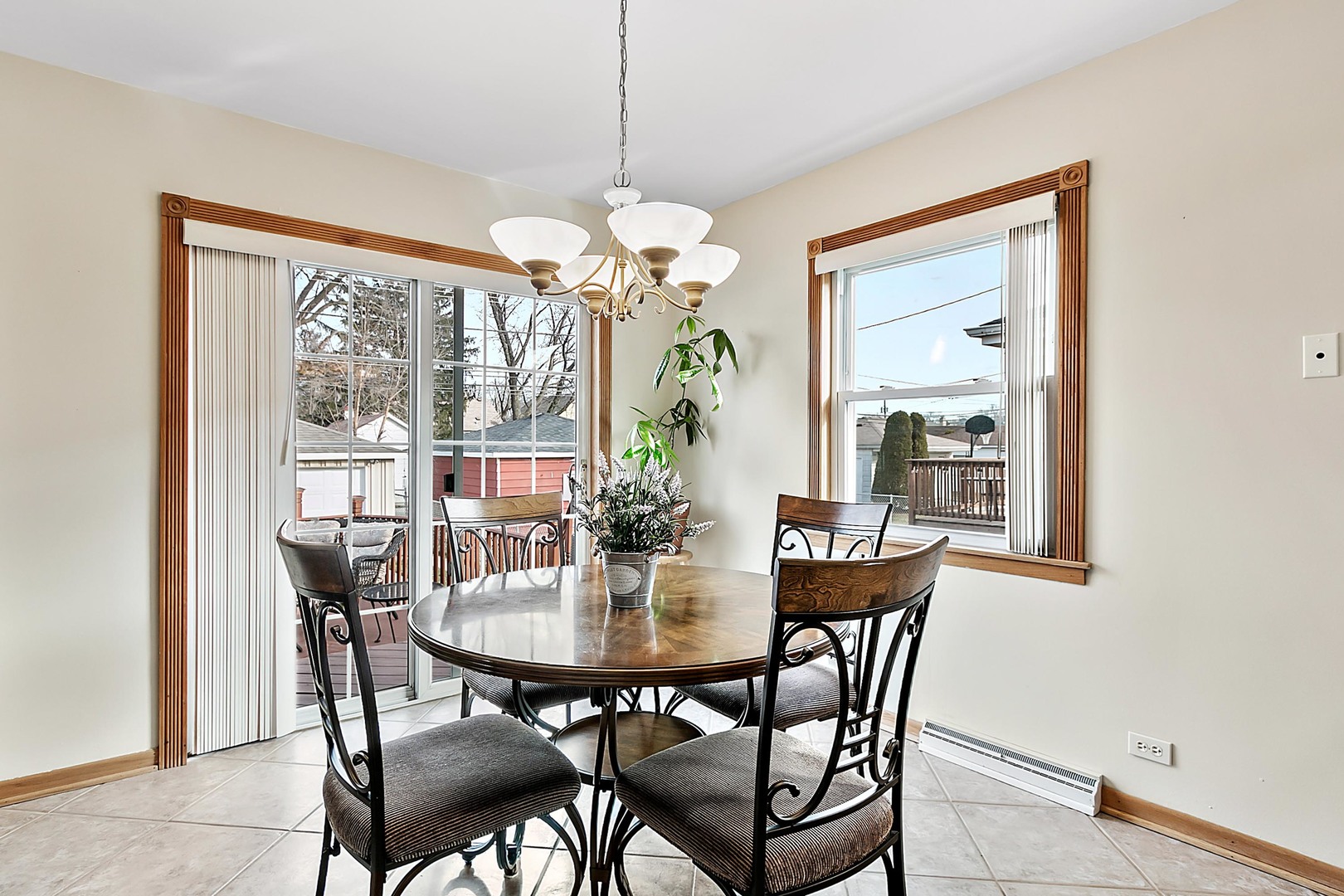 4031 Custer Avenue Lyons, IL 60534 - Photo 9 of 19 a dining room with furniture a chandelier and window