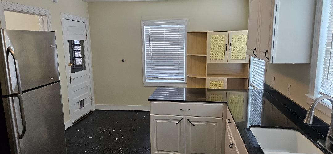 932 Walling Street Houston, TX 77009 - Photo 3 of 14 a kitchen with a refrigerator a sink and dishwasher