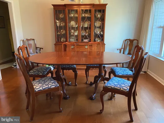 a spacious bedroom with a bed and a chandelier