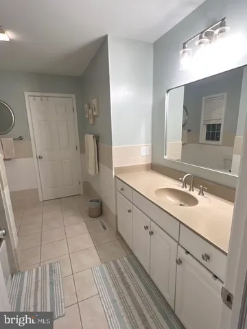 a white toilet sitting next to a bathroom sink