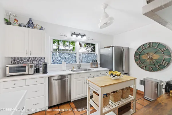 a kitchen with cabinets a sink and a stove
