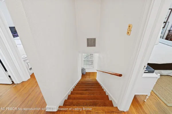 a bedroom with a bed and a tv