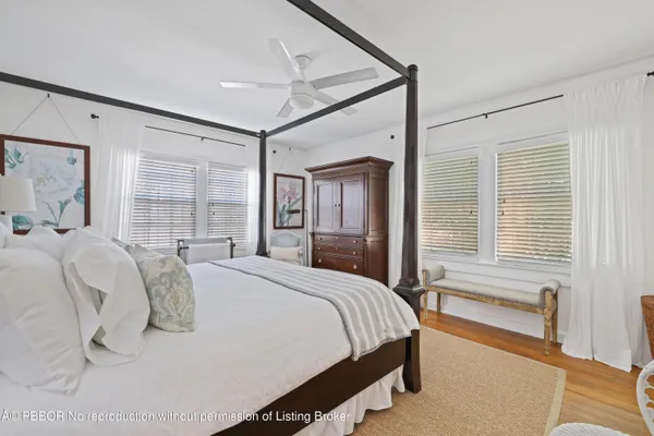 a bed room with a bed and a window