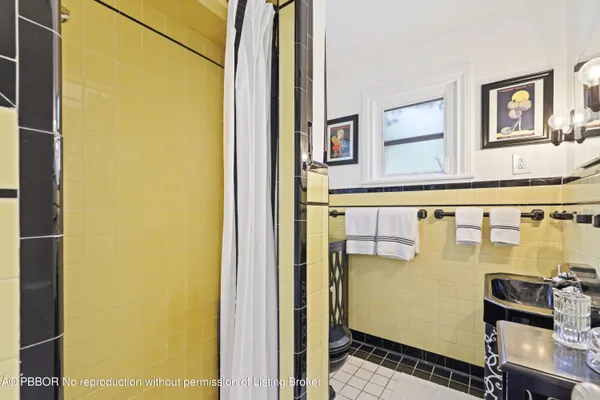 a view of a tables and chairs under an umbrella in the patio