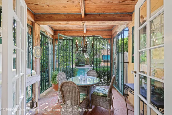 a view of a chair and table in the backyard