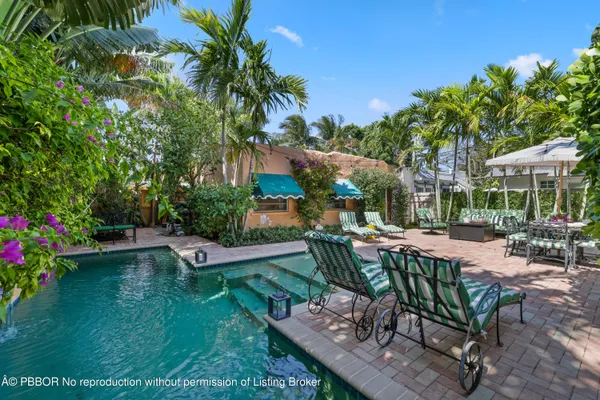 a bathroom with a sink mirror vanity and toilet