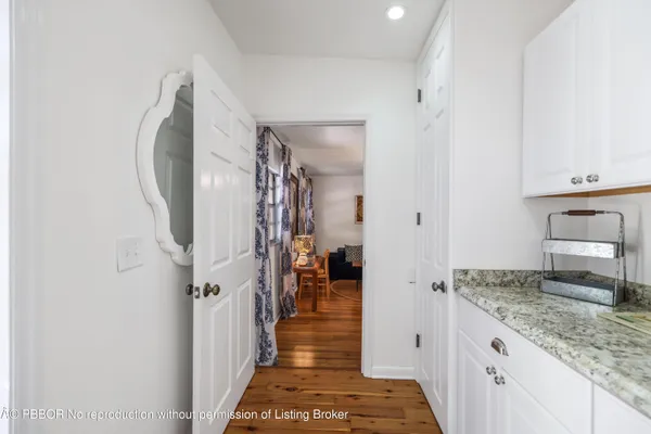 a view of a balcony with wooden floor and city view
