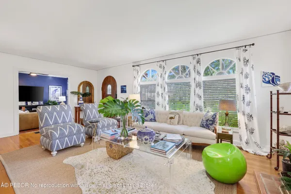 a living room with furniture and a rug