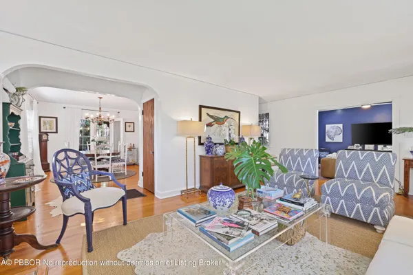a bedroom with furniture and a flat screen tv