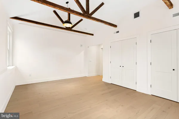 a bathroom with 2 sink and a mirror