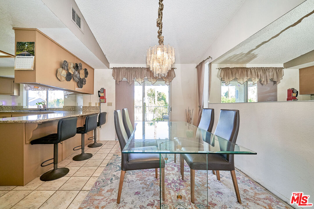 68920 Minerva Road Cathedral City, CA 92234 - Photo 14 of 49 a view of a dining room with furniture window and outside view