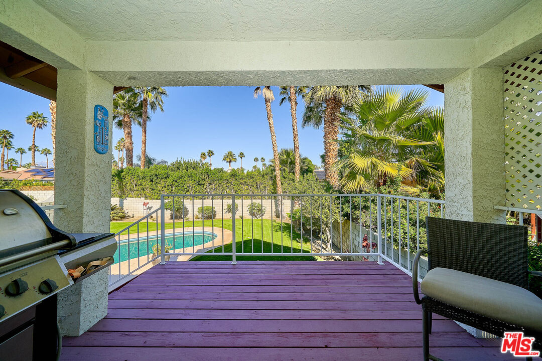 68920 Minerva Road Cathedral City, CA 92234 - Photo 16 of 49 a room with furniture and a floor to ceiling window