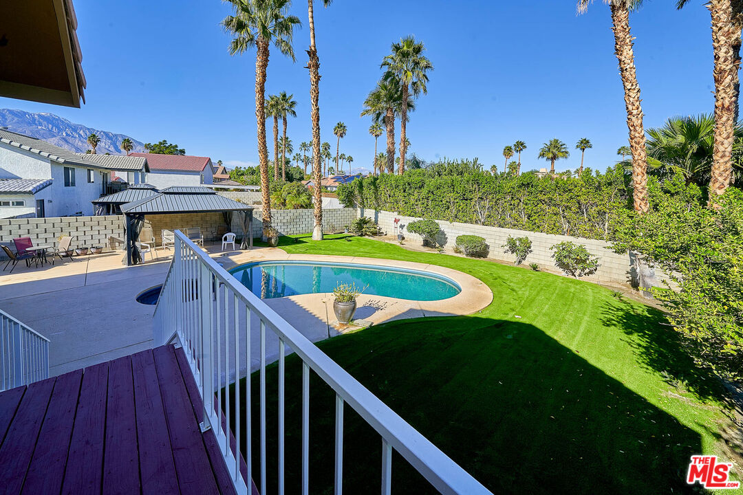 68920 Minerva Road Cathedral City, CA 92234 - Photo 18 of 49 a view of a balcony with chairs and wooden floor