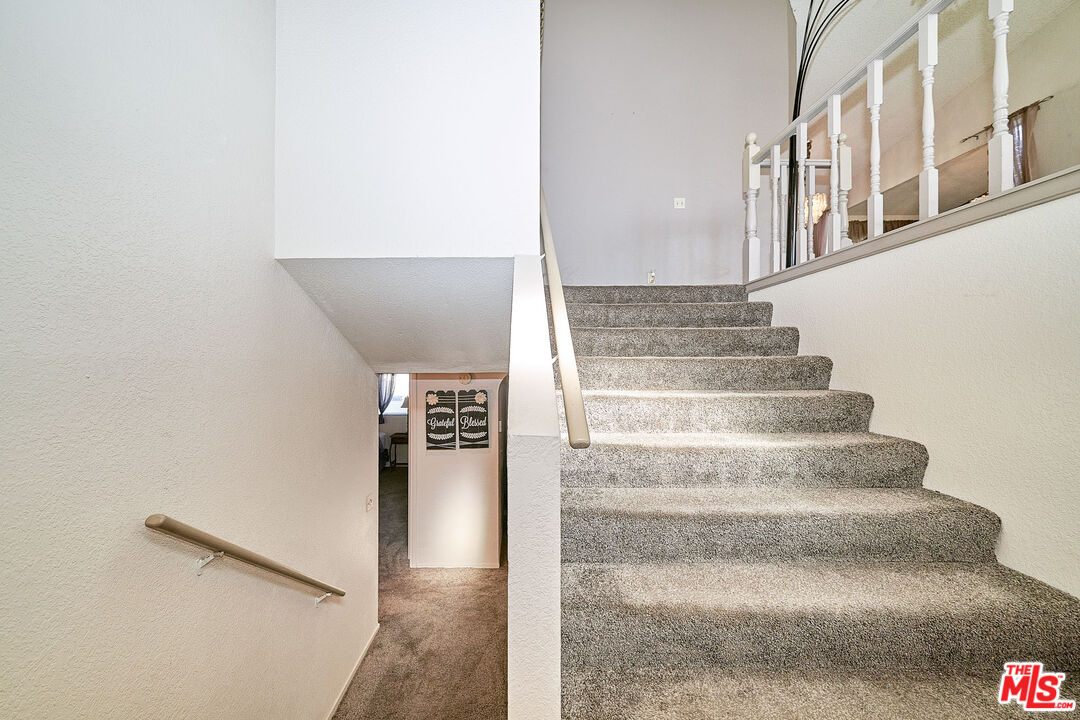 68920 Minerva Road Cathedral City, CA 92234 - Photo 25 of 49 a view of staircase with white walls