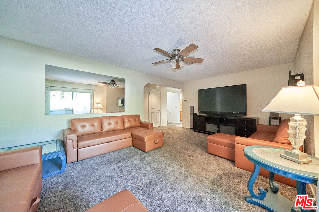 68920 Minerva Road Cathedral City, CA 92234 - Photo 29 of 49 a living room with furniture and a flat screen tv