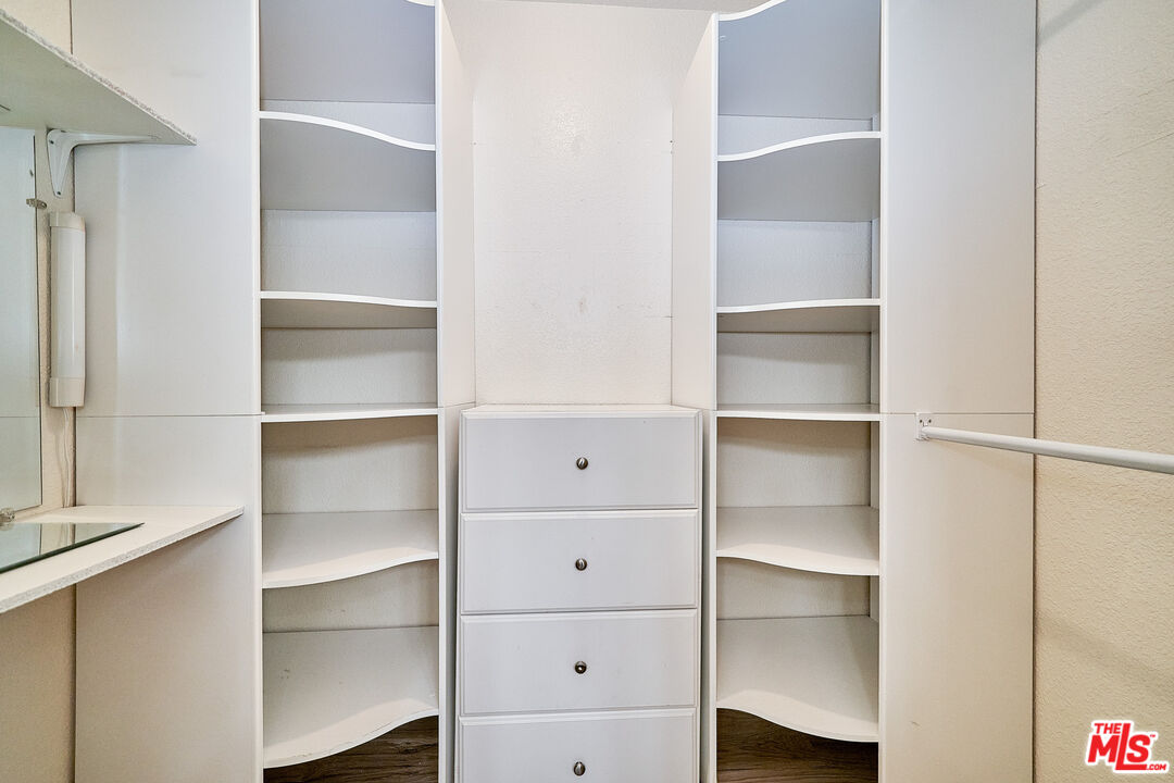 68920 Minerva Road Cathedral City, CA 92234 - Photo 36 of 49 a view of walk in closet with empty racks