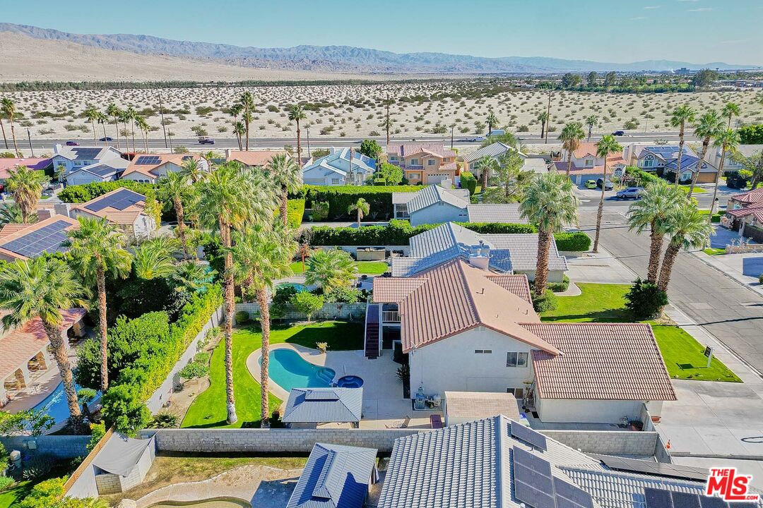 68920 Minerva Road Cathedral City, CA 92234 - Photo 48 of 49 an aerial view of a house with a garden and lake view