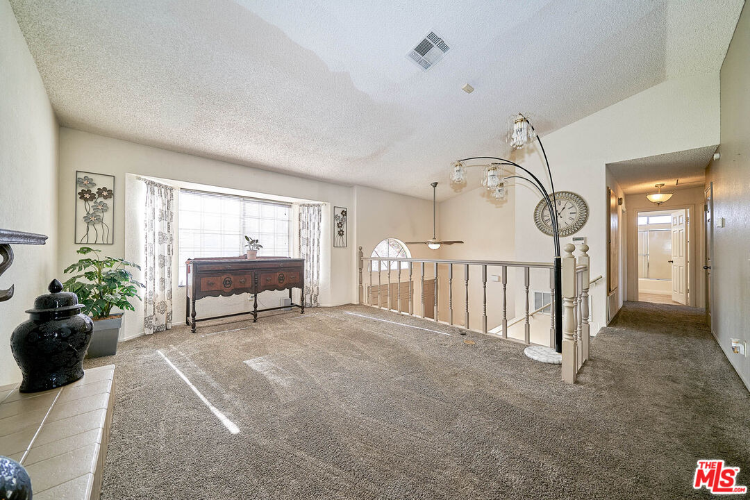 68920 Minerva Road Cathedral City, CA 92234 - Photo 6 of 49 a view of a livingroom with furniture and a hallway