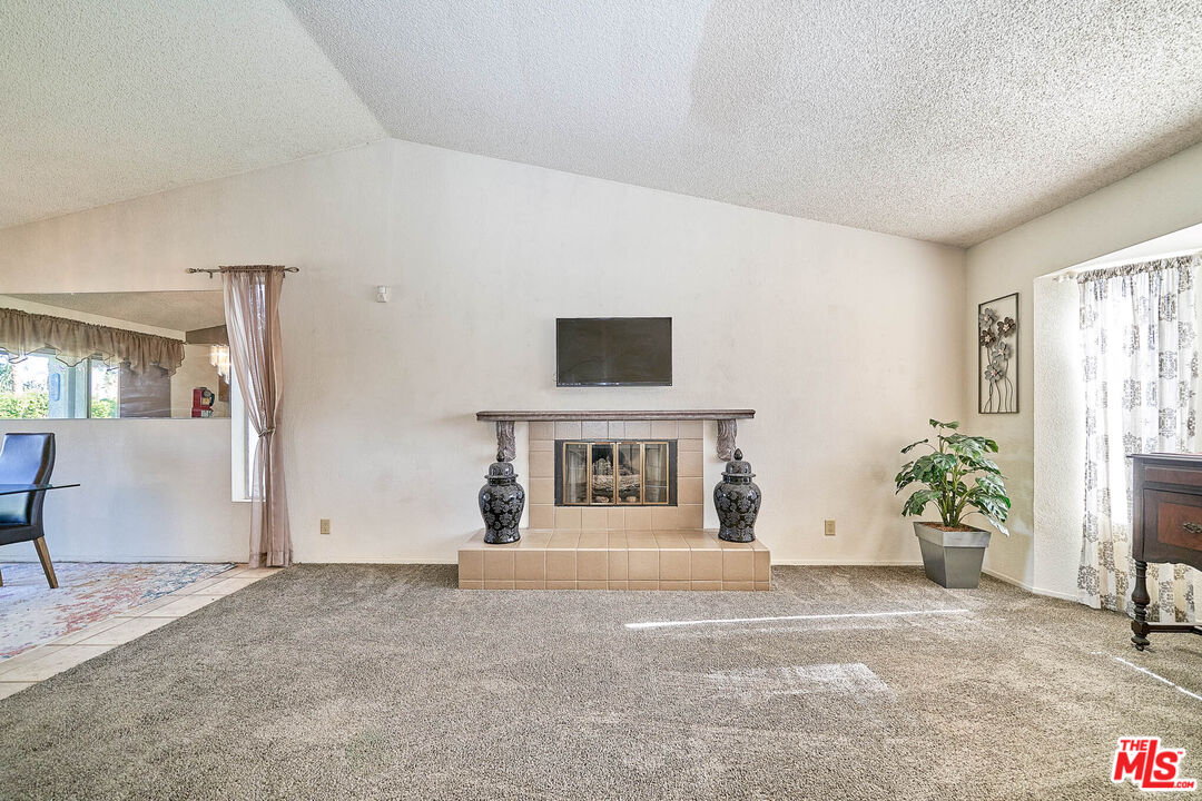 68920 Minerva Road Cathedral City, CA 92234 - Photo 8 of 49 a view of a livingroom with a flat screen tv