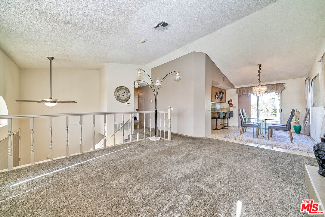 68920 Minerva Road Cathedral City, CA 92234 - Photo 9 of 49 a spacious bedroom with a bed a table and a large window