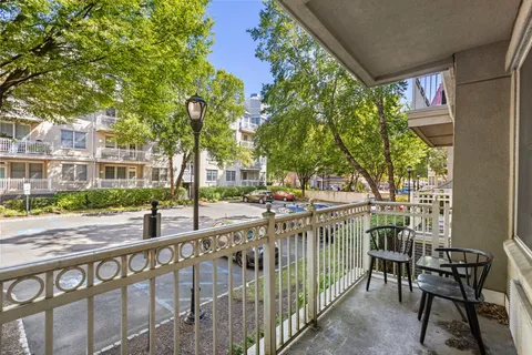 a view of a patio with table and chairs and potted plants
