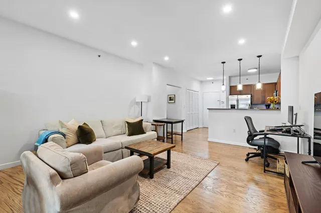 a living room with furniture and a rug