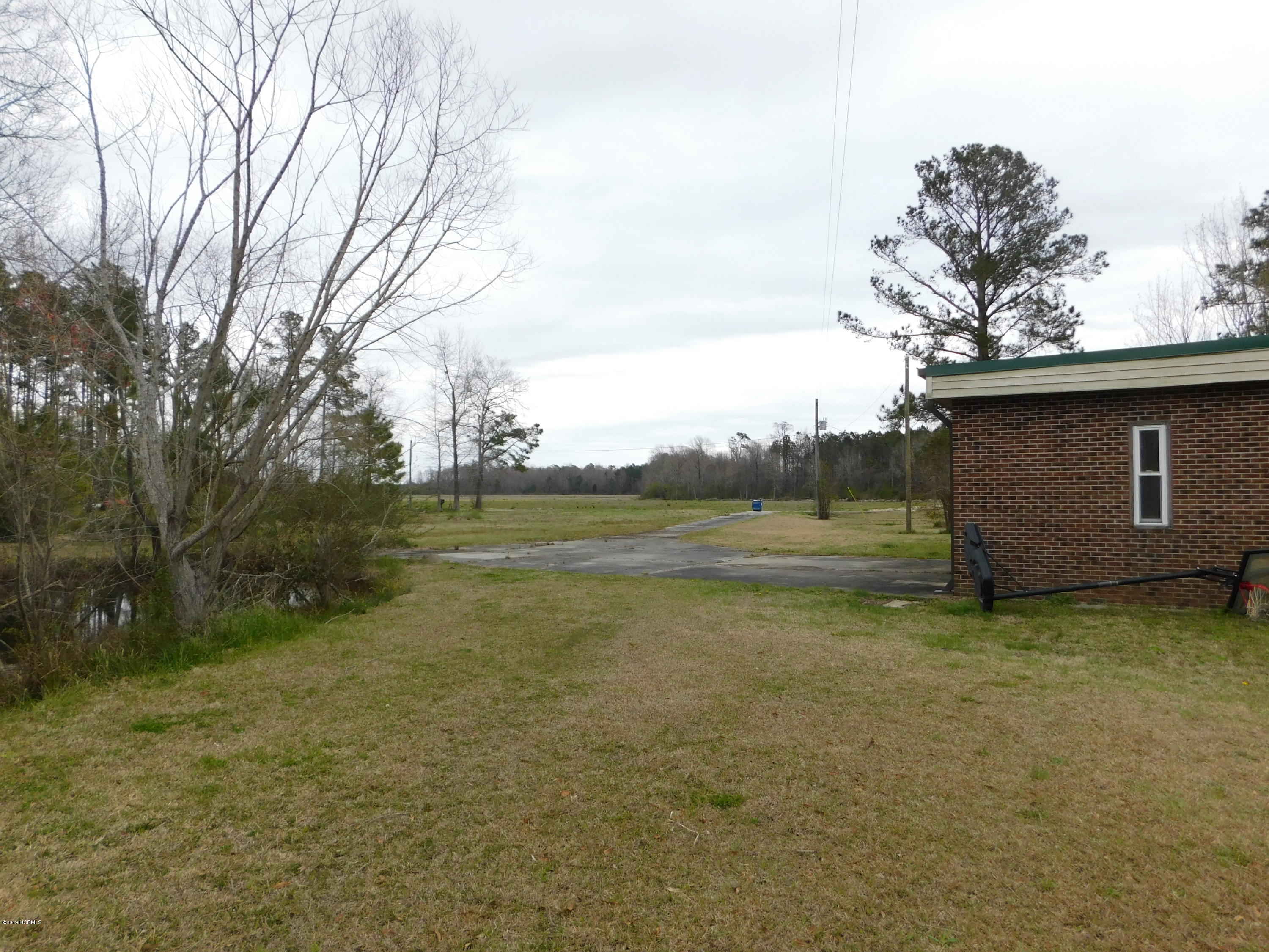 345 Cowell Loop Road Bayboro, NC 28515 - Photo 9 of 44 Right side facing the house, lies the pond.