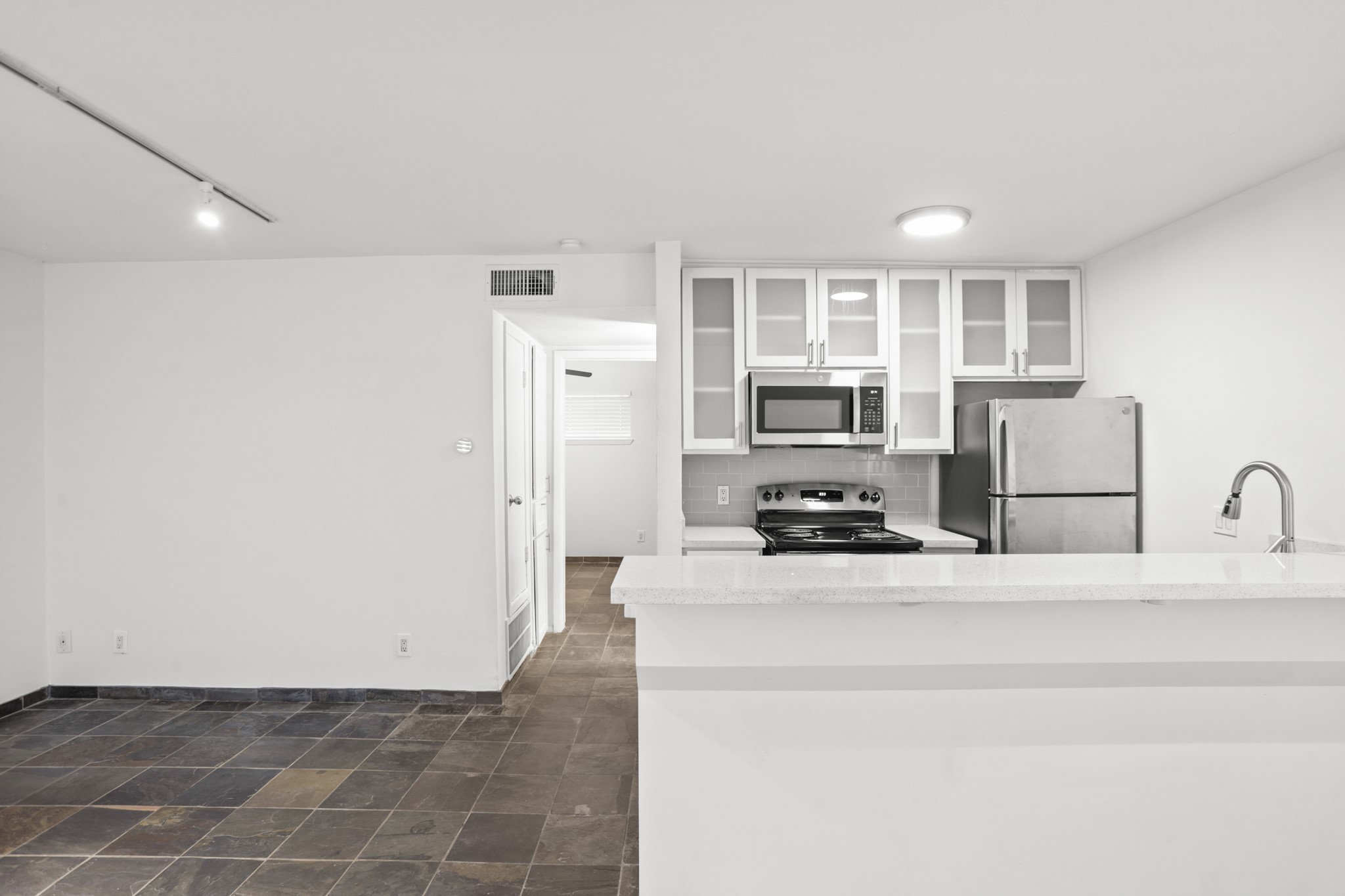3602 Garrott Street, Unit 12 Houston, TX 77006 - Photo 4 of 34 The kitchen is open to the family room and dining space.