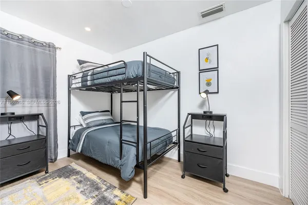 a bedroom with a bed and a closet