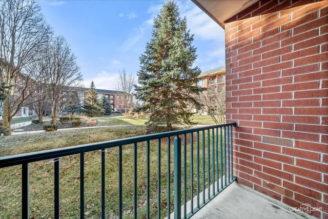 a view of a brick building from a balcony