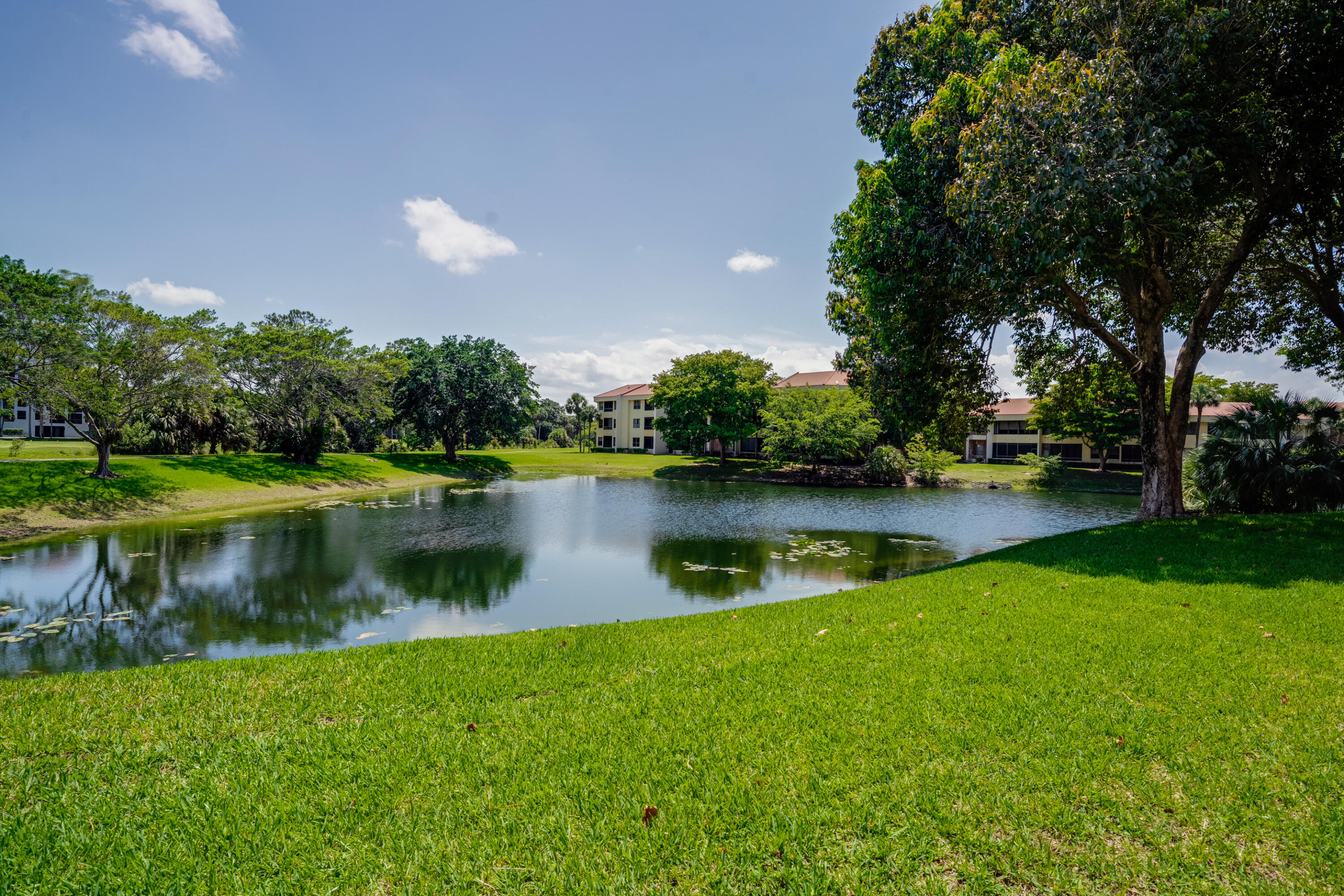 7472 La Paz Boulevard, Unit 102 Boca Raton, FL 33433 - Photo 6 of 14 a view of lake background with house