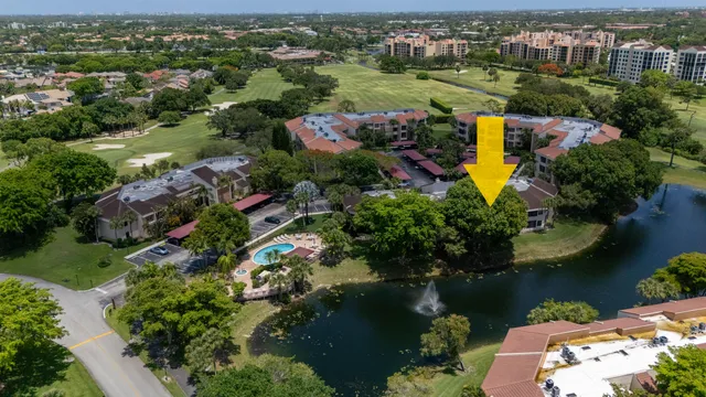 an aerial view of a house with a lake view