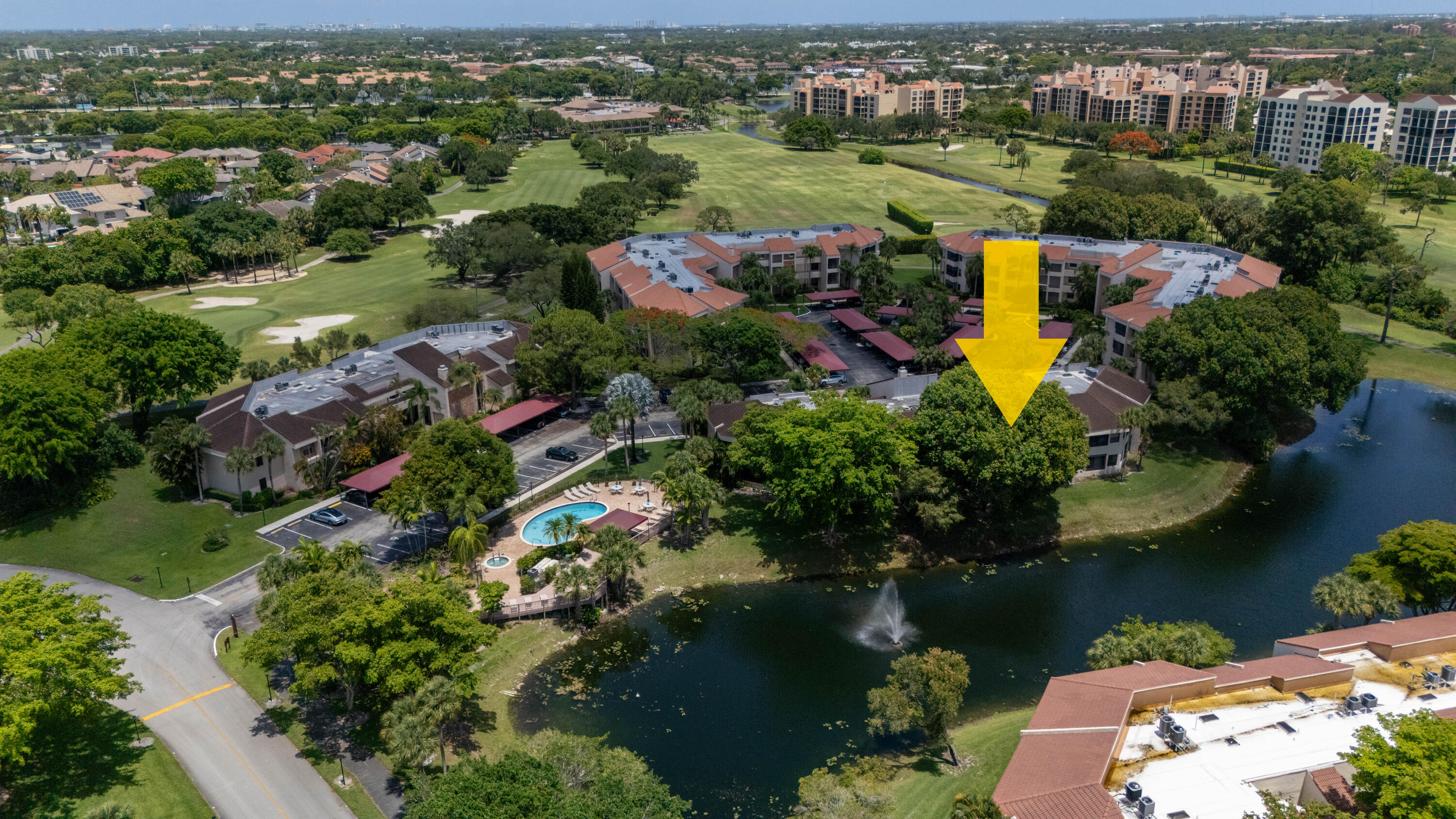 7472 La Paz Boulevard, Unit 102 Boca Raton, FL 33433 - Photo 9 of 14 an aerial view of a house with a lake view