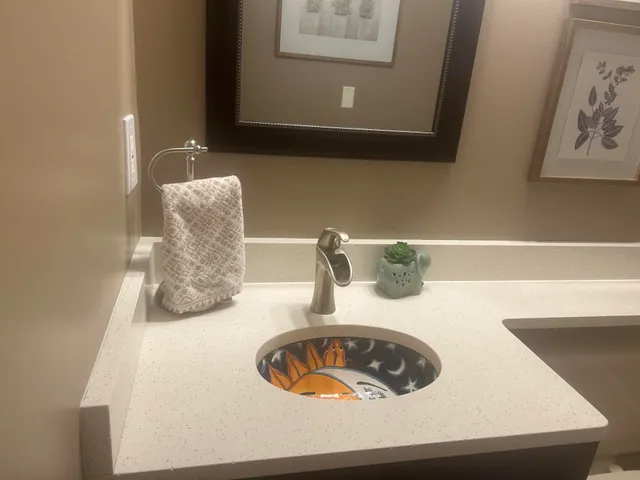 a bathroom with a sink and a mirror