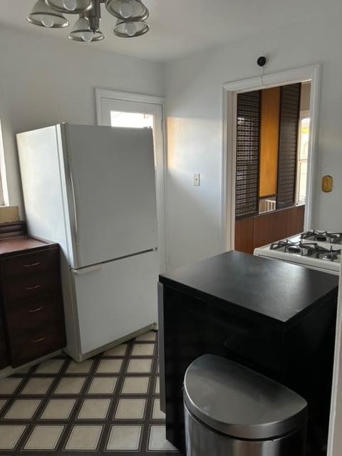 1606 Stannage Avenue Berkeley, CA 94702 - Photo 12 of 16 a bathroom with a sink a toilet a mirror and vanity