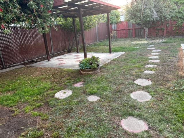 1606 Stannage Avenue Berkeley, CA 94702 - Photo 4 of 16 a backyard of a house with table and chairs